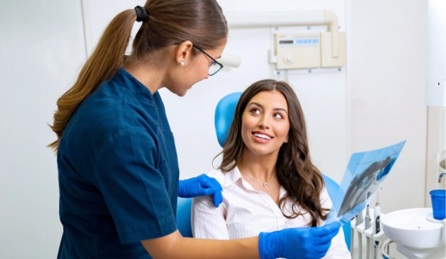 dentist showing xray to dental patient